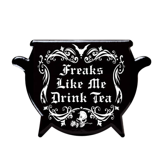 Black cauldron coaster with white text 'Freaks Like Me Drink Tea' and Alchemy logo on a white background