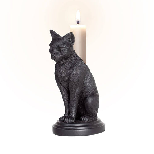 Black cat-shaped candle holder with a lit candle on a white background