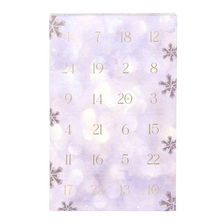 Advent calendar with snowflake design and gold numbers on a white background