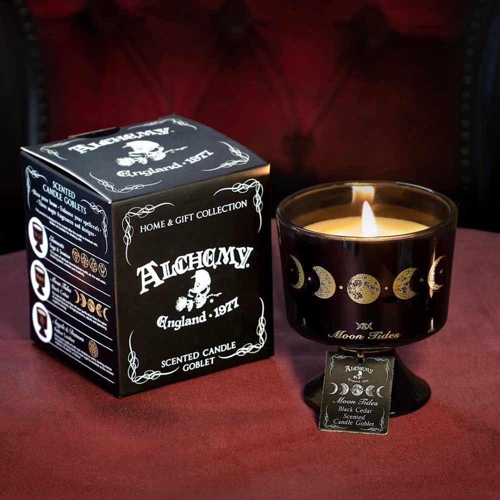 Alchemy scented candle with packaging on a dark background