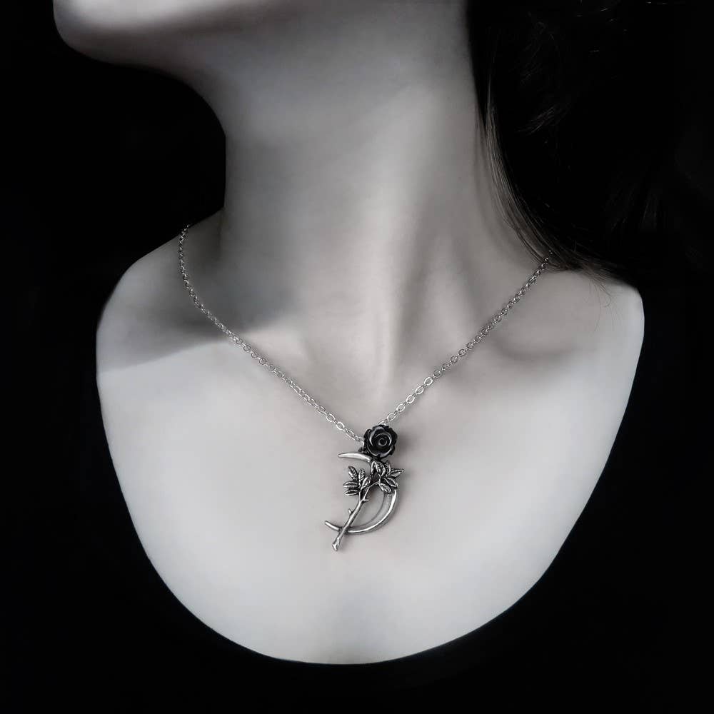 Necklace with a unique pendant on a mannequin neck against a black background