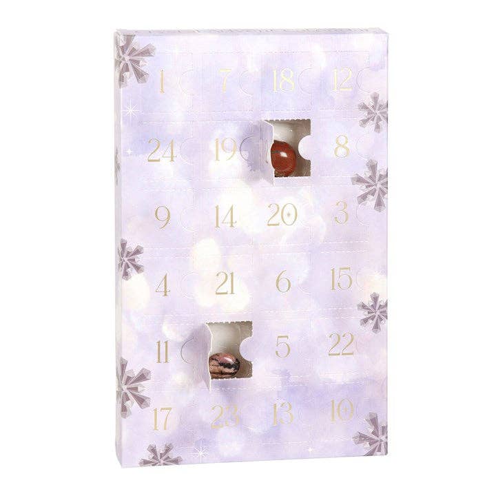 Advent calendar with snowflake design and numbered windows on a white background