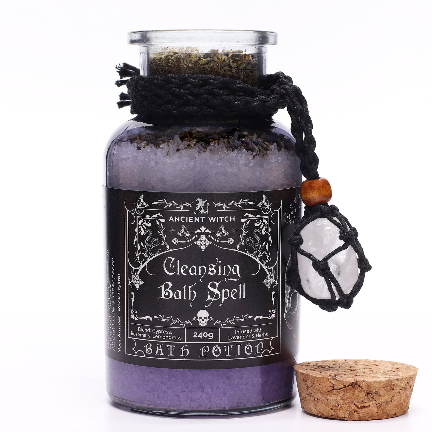 Glass jar containing bath salts with amulet attached and label stating cleansing bath spell
