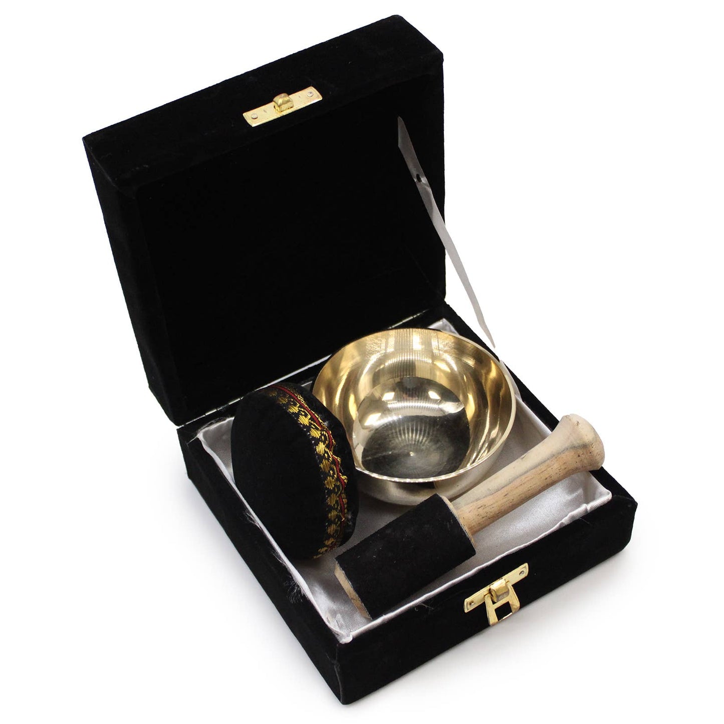Gift set of singing bowl including a suede covered stick, bowl, and cushion in a black velvet box on a white background.