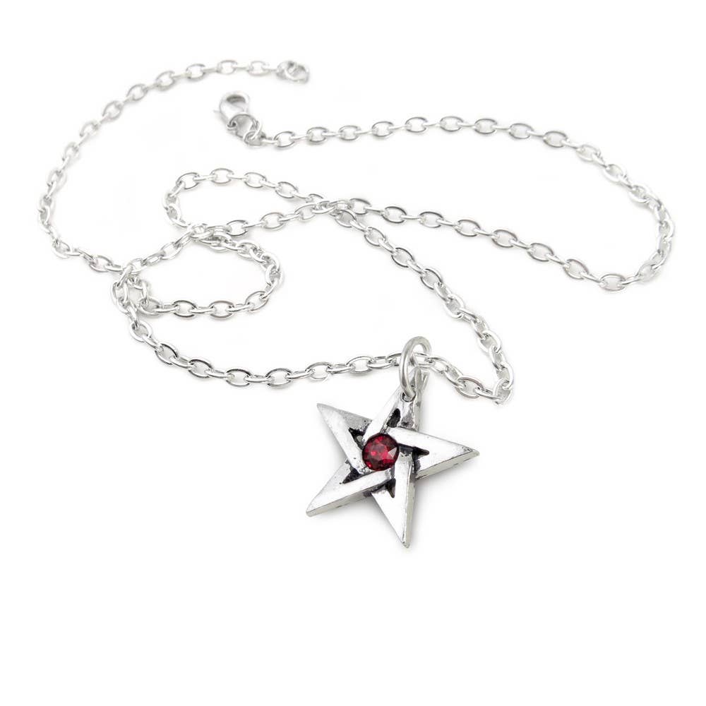 Silver star-shaped pendant with a red gemstone on a chain against a white background