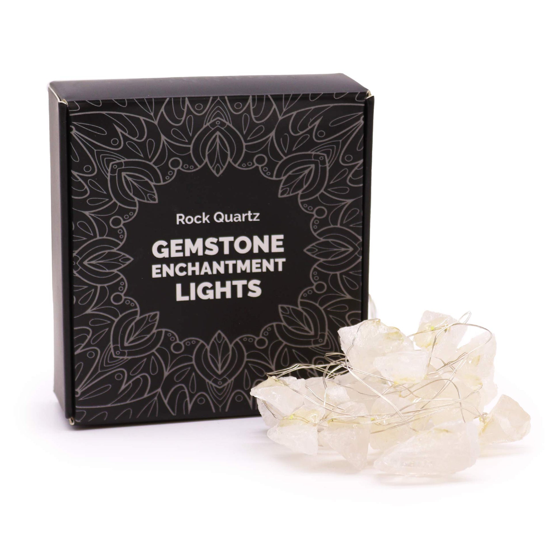 Rock Quartz gemstone enchantment lights with black box on white background