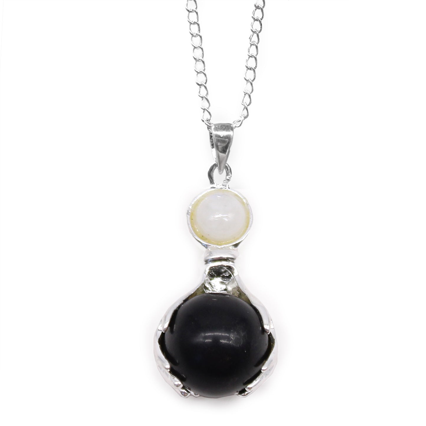 Necklace with a pendant featuring a black agate sphere and a white gem on a white background