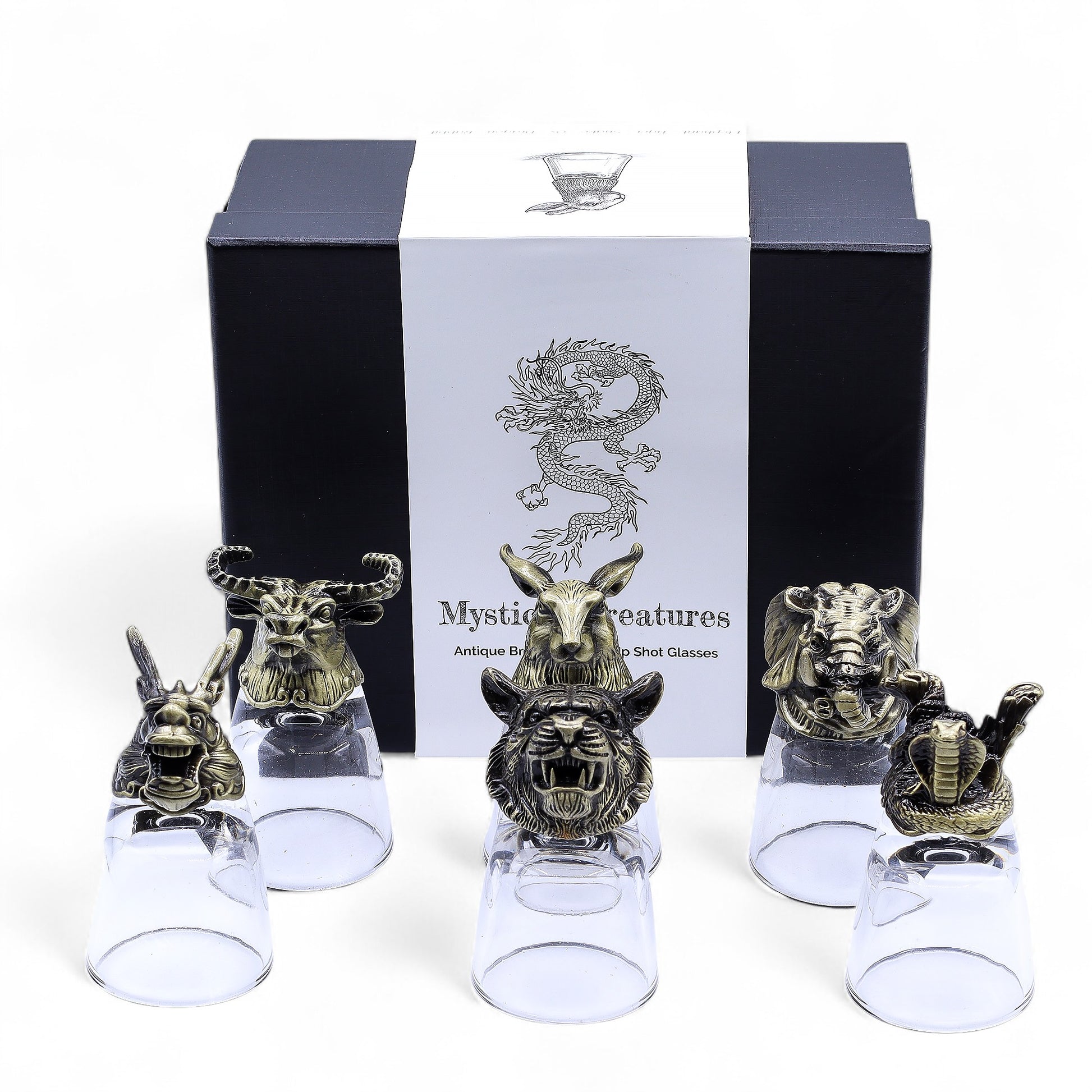 Mystical creatures shot glasses pictured in front of gift box on white background
