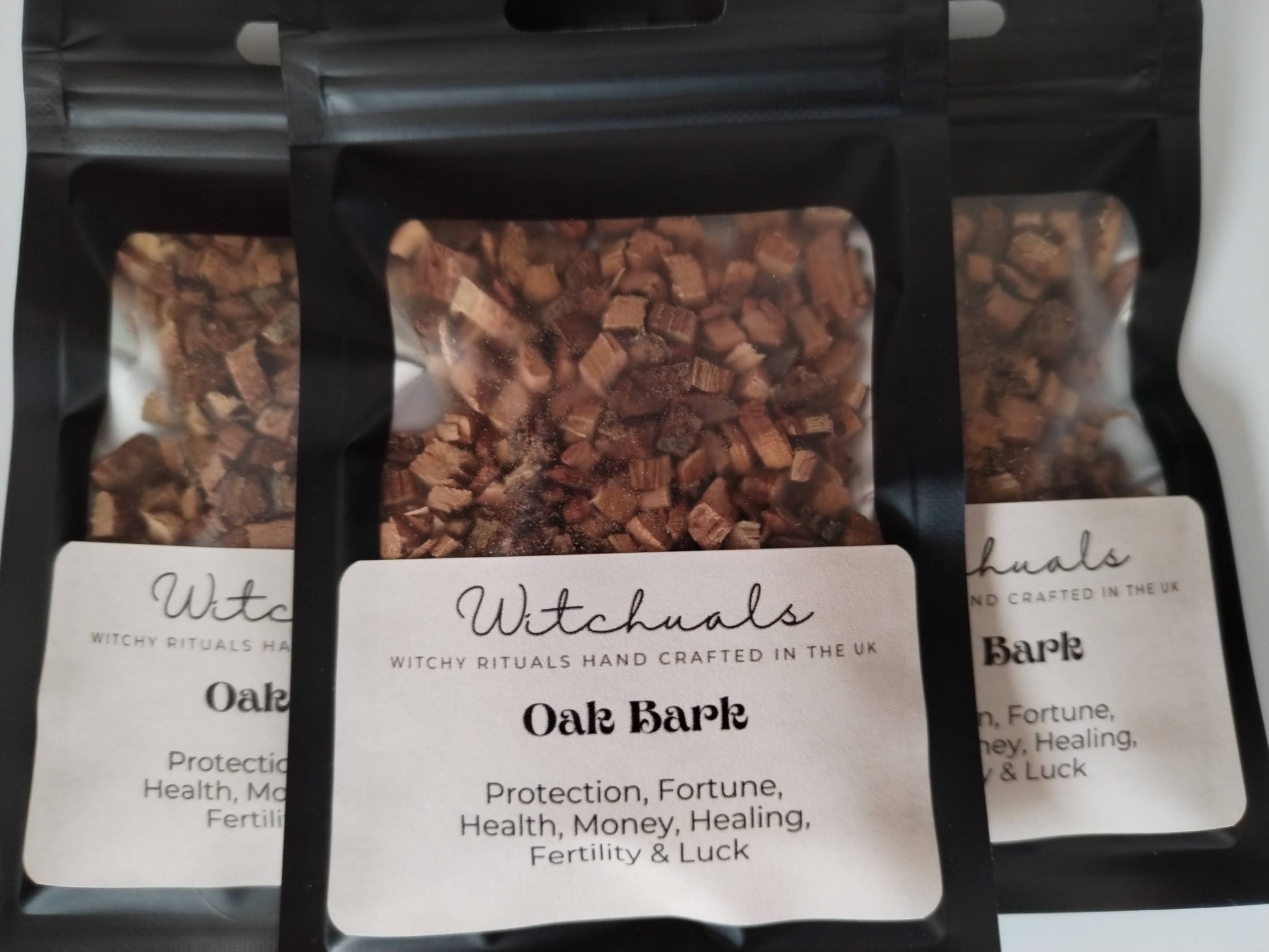 Three packages of Witchuals Oak Bark with labels on a white background