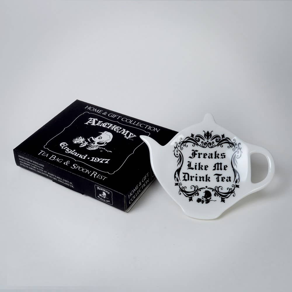 Tea bag and spoon rest set with decorative text on a white background