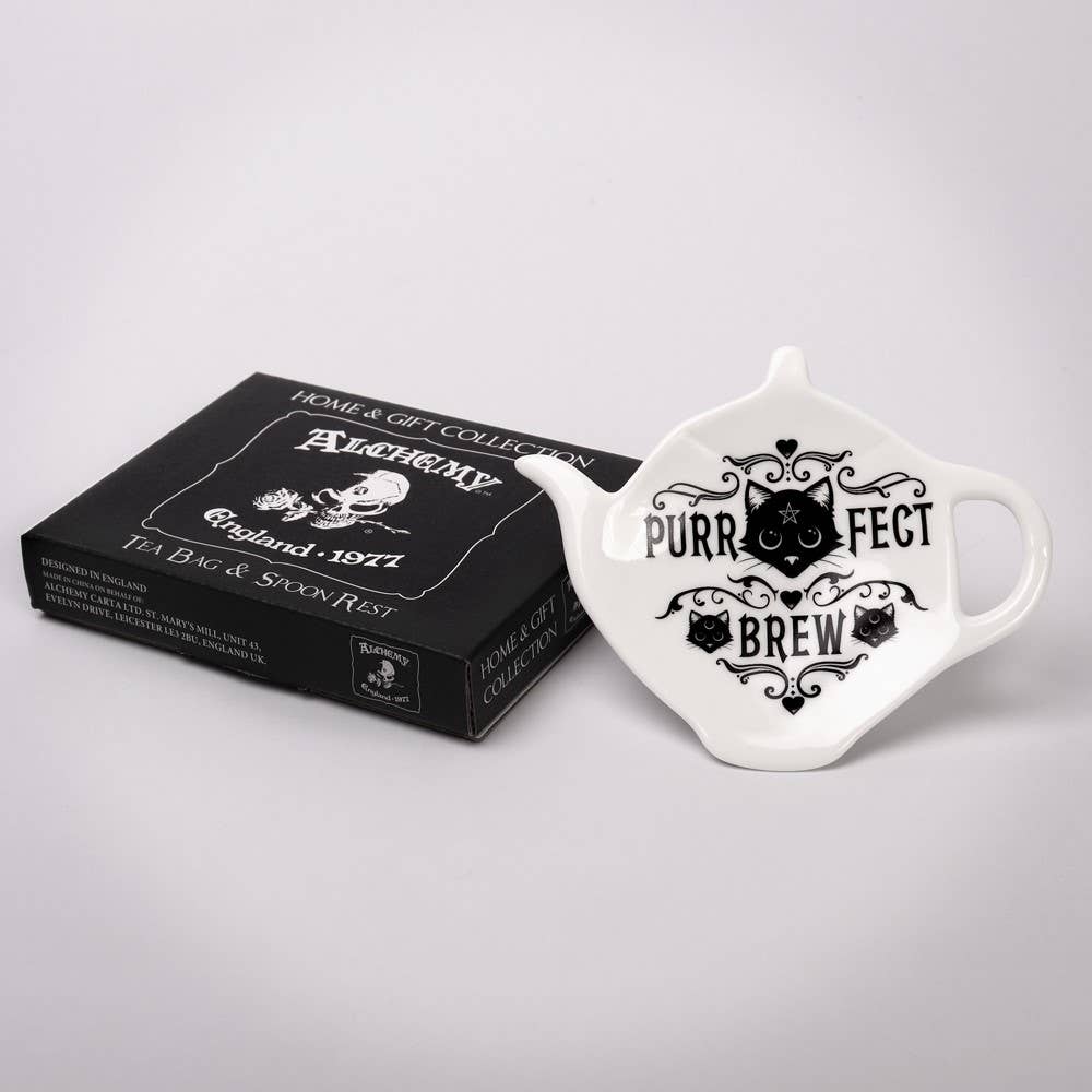 Tea bag holder with 'Purr fect Brew' text and a black box labeled 'Alchemy England' on a light gray background