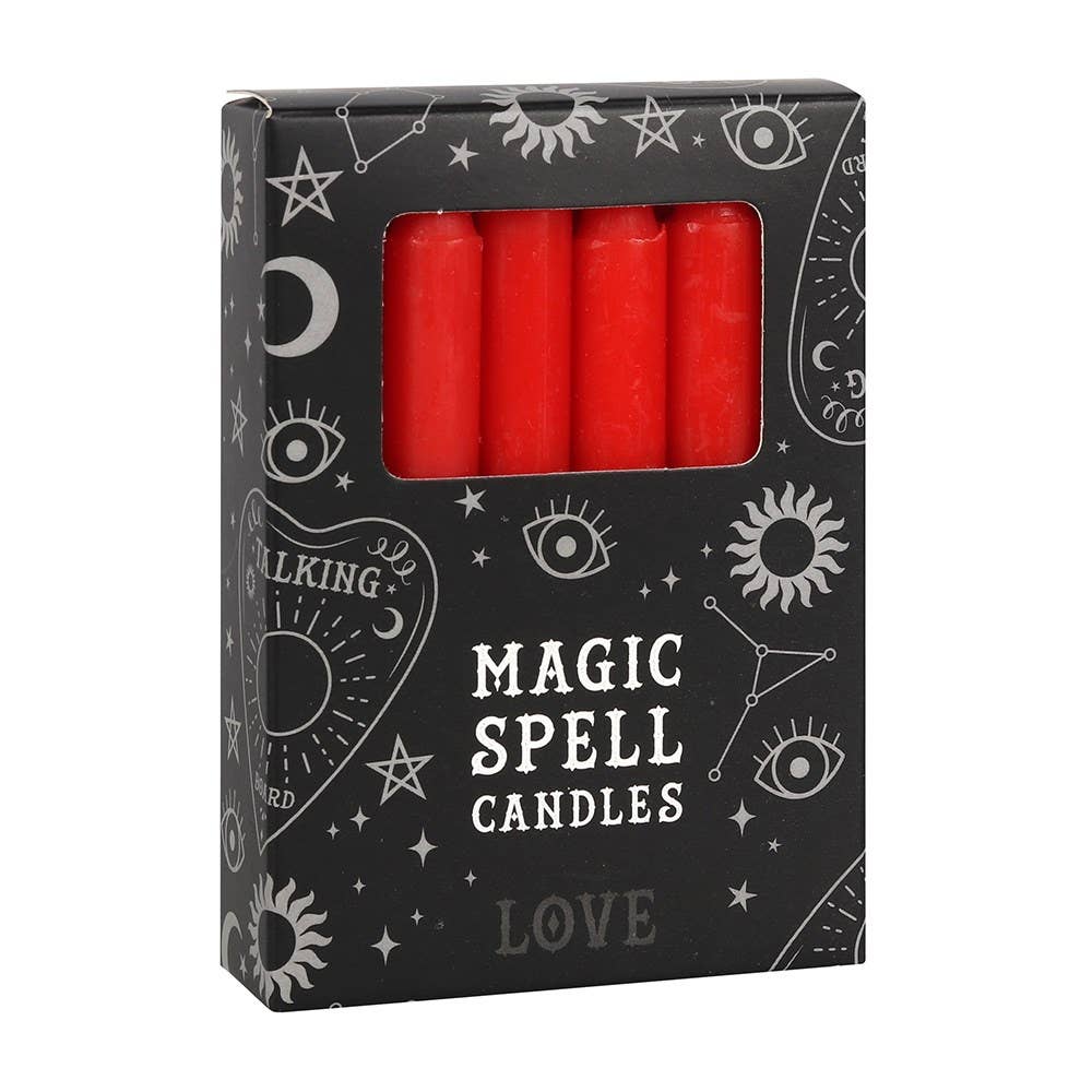 Box of red 'Magic Spell Candles' with wiccan symbols on a white background