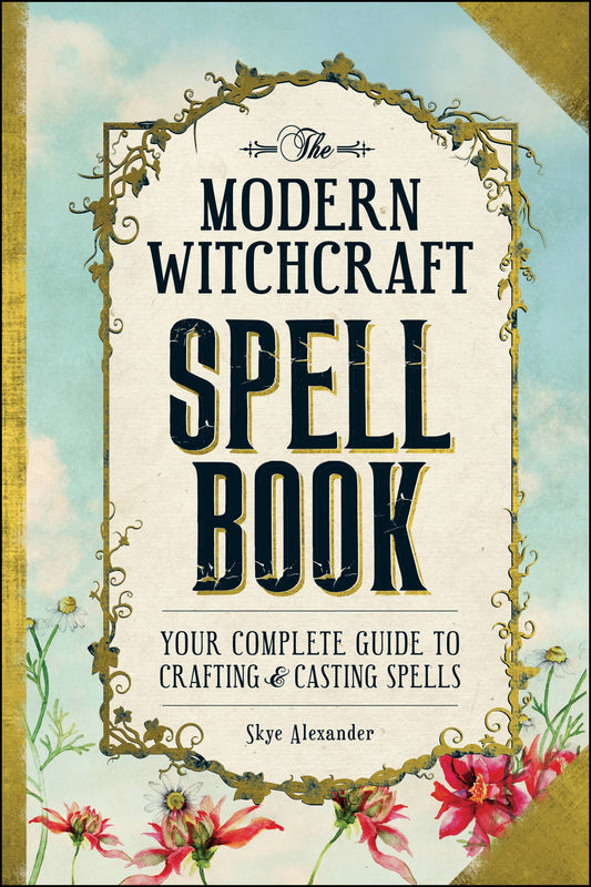 Book titled 'The Modern Witchcraft Spell Book' with decorative elements and floral design on a blue background.