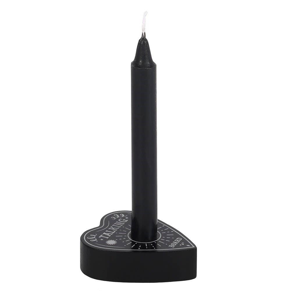 Black candle holder with a candle on a white background