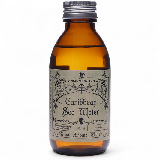 Brown bottle with grey label detailing Caribbean Sea Water from Ancient Witch