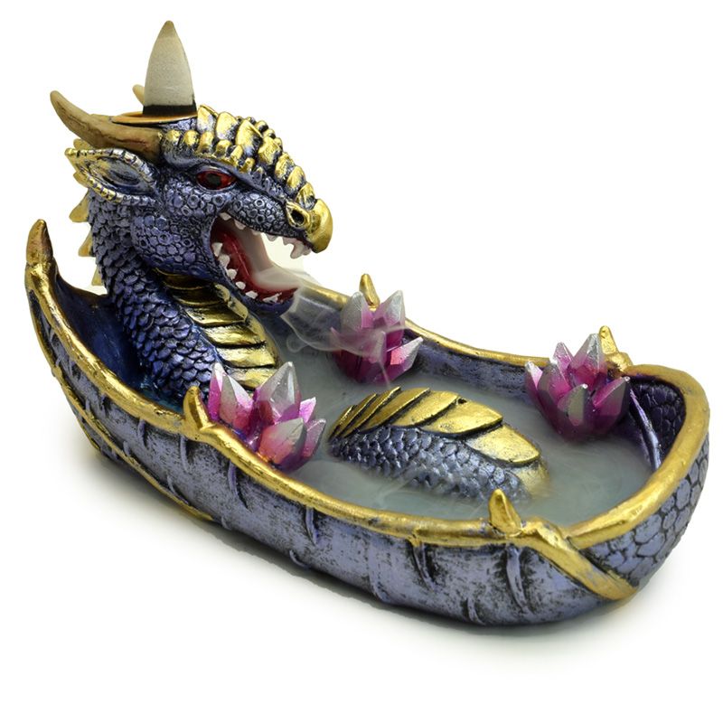 Decorative dragon backflow incense holder with gold accents and pink flowers on a white background