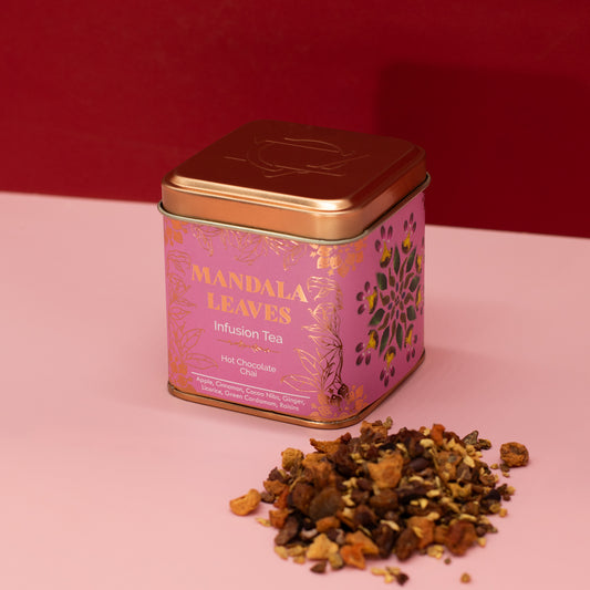 Mandala Leaves hot chocolate chai infusion tea beside a pink and gold tin