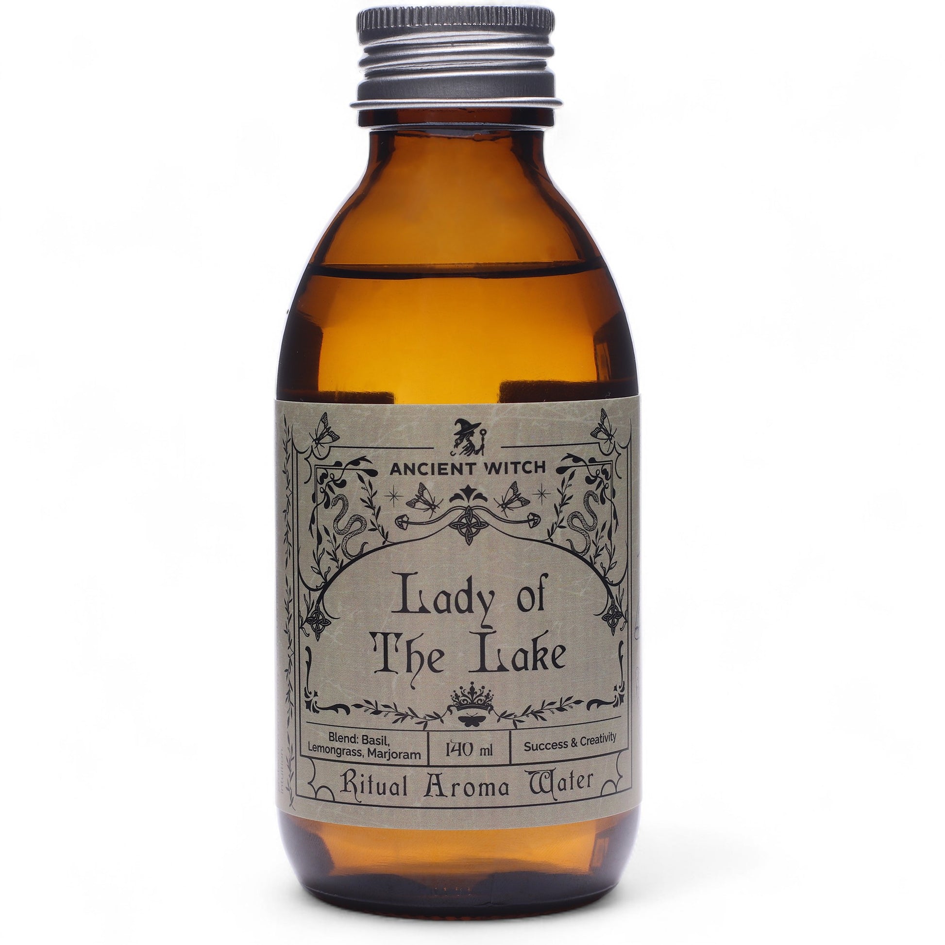 Brown bottle containing ritual waters from the Lady of the Lake with a grey label featuring an Ancient Witch design