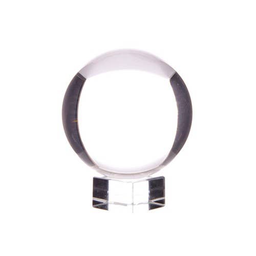 Clear crystal ball on clear stand with white background