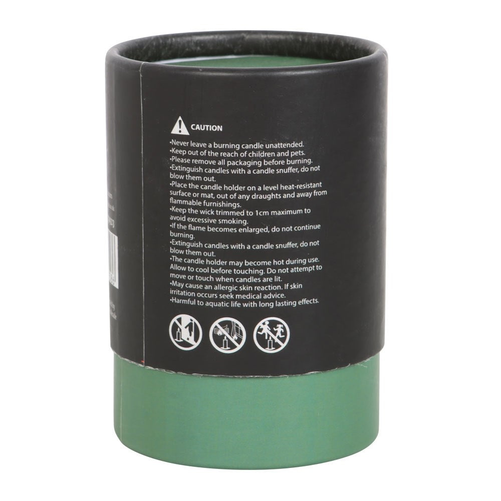 candle instructions on back of black and green packaging