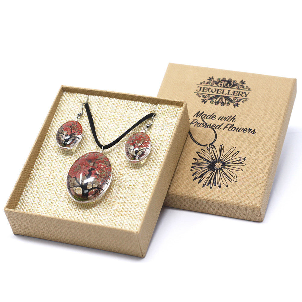 Necklace and earrings made with real pressed flowers displayed in natural gift box