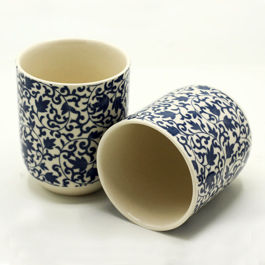 Set 2 herbal tea cups blue pattern on white background