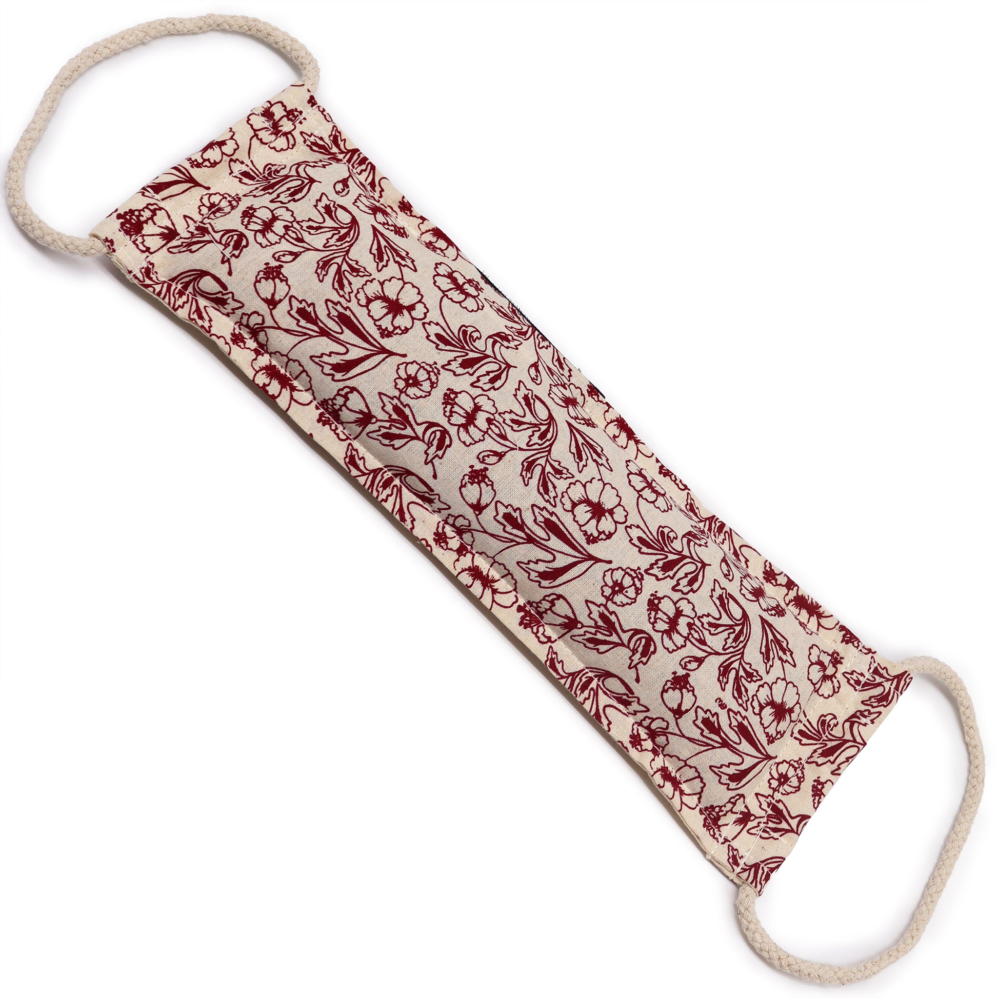 Fabric pillow with red floral pattern on a white background